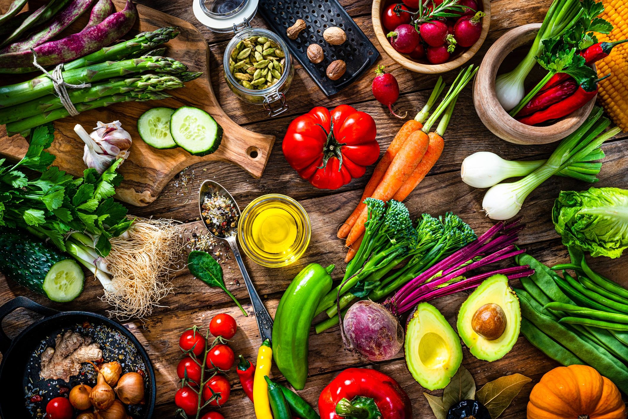 Overhead view of fresh organic vegetables on a rustic table