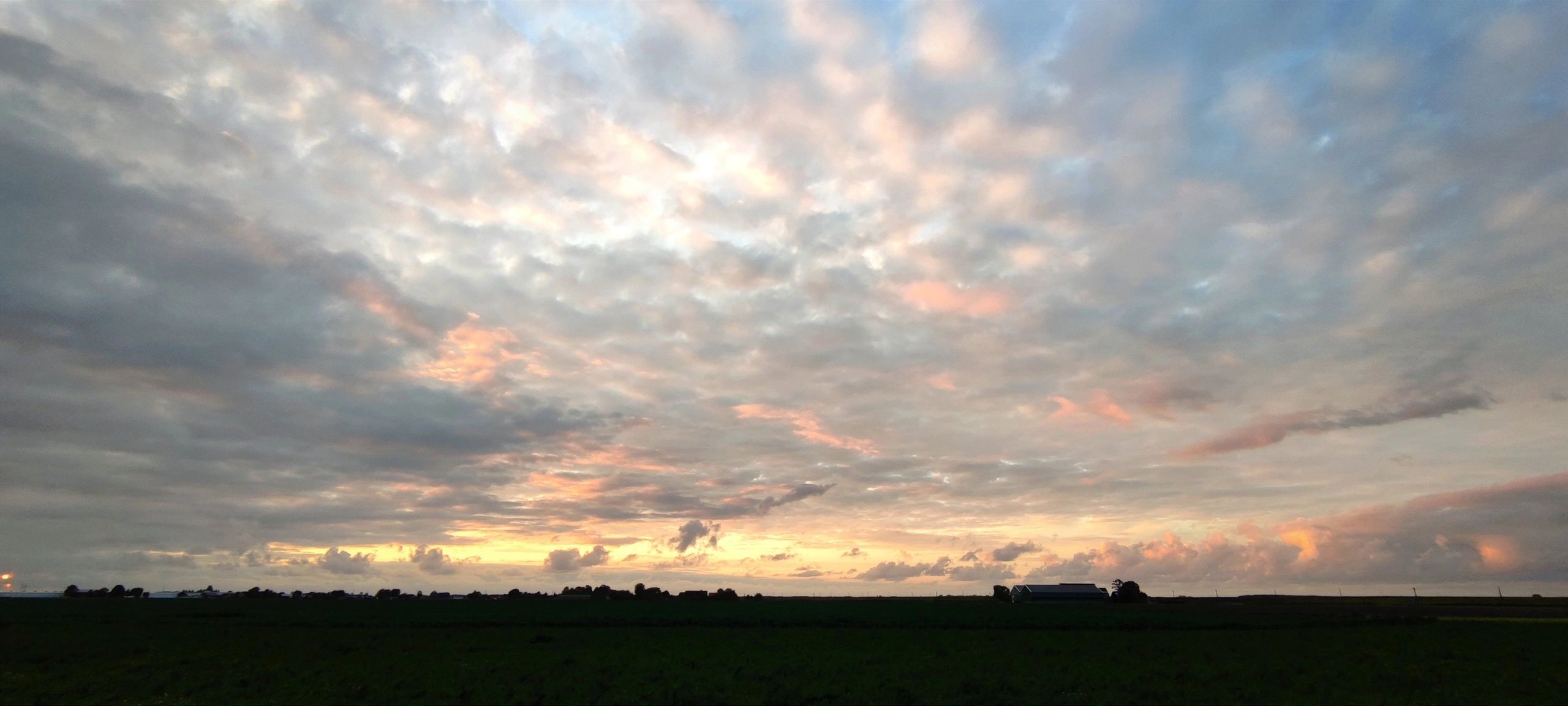 Evening clouds over a rural landscape